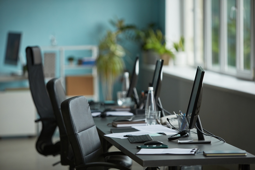 modern,office,workspace,featuring,empty,ergonomic,chairs,and,computer,monitors